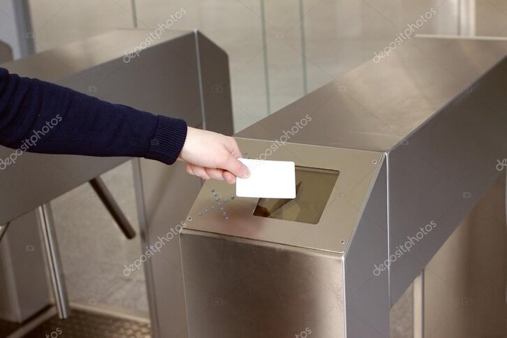 Employee using access control card on office door reader